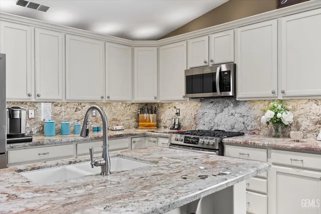 a bathroom with a tub shower and sink