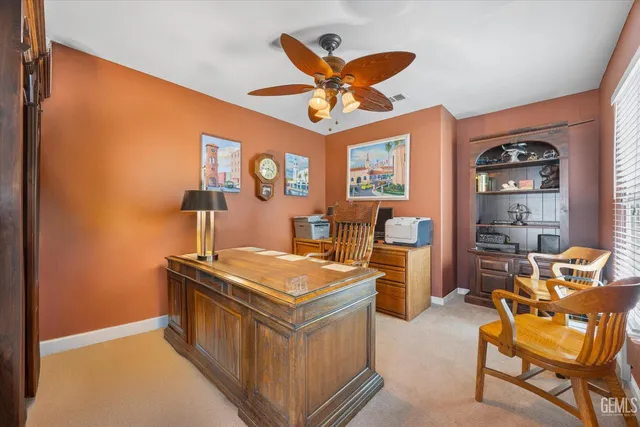 a bathroom with a granite countertop sink mirror and a bathtub