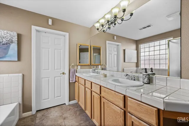 a view of a house with patio and a garden
