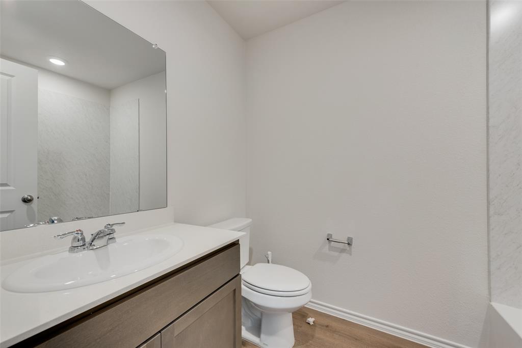 1428 Millstead Rill Drive Caddo Mills, TX 75135 - Photo 20 of 24 a bathroom with a sink toilet and vanity