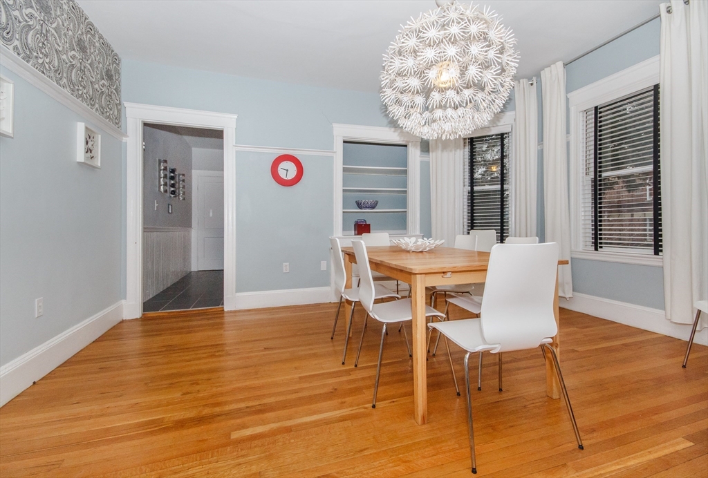 584 Centre Street Boston, MA 02130 - Photo 22 of 29 a view of a dining room with furniture and chandelier