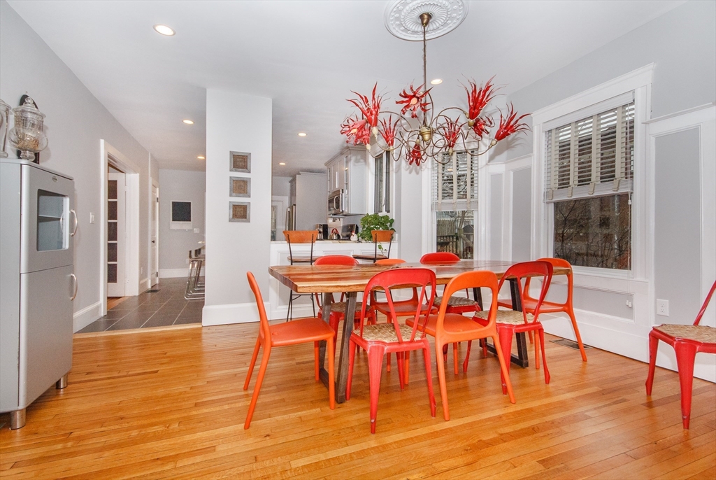 584 Centre Street Boston, MA 02130 - Photo 3 of 29 a dining room with furniture potted plants and wooden floor