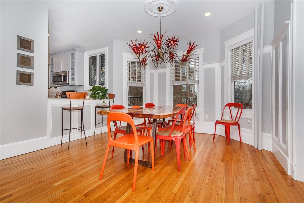 584 Centre Street Boston, MA 02130 - Photo 4 of 29 a view of a dining room with furniture and wooden floor