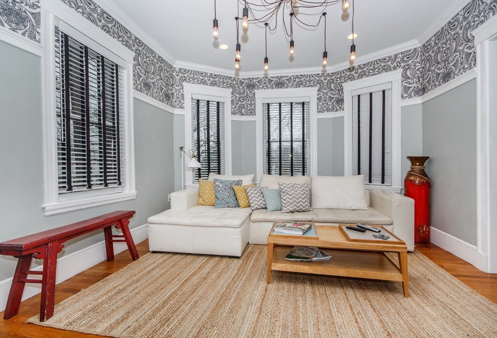 584 Centre Street Boston, MA 02130 - Photo 6 of 29 a living room with furniture and wooden floor