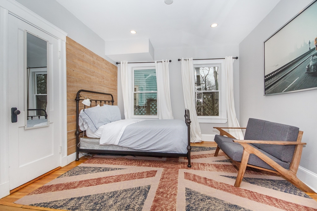 584 Centre Street Boston, MA 02130 - Photo 10 of 29 a bedroom with a bed and a window