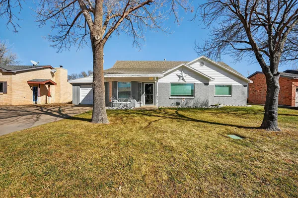 a view of a house with snow on the tree