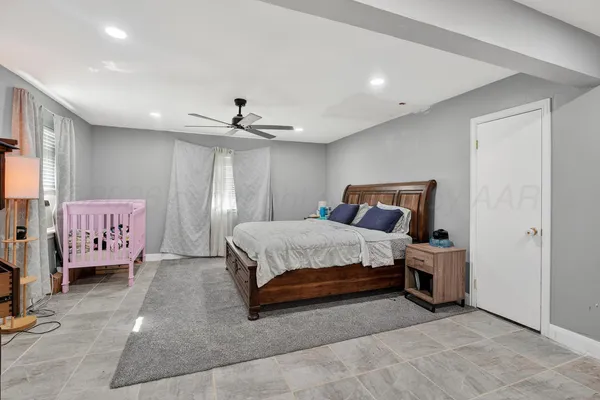 a bedroom with a bed and cabinets