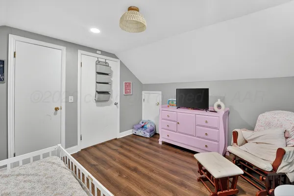 a bedroom with a bed and furniture