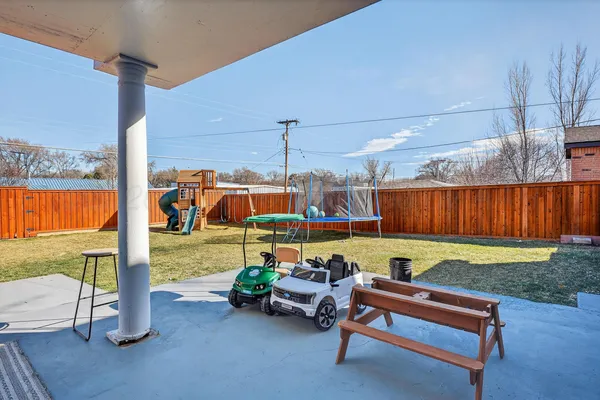 a sitting area with chairs and pool table