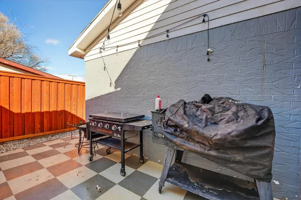a table and chairs in front of a door