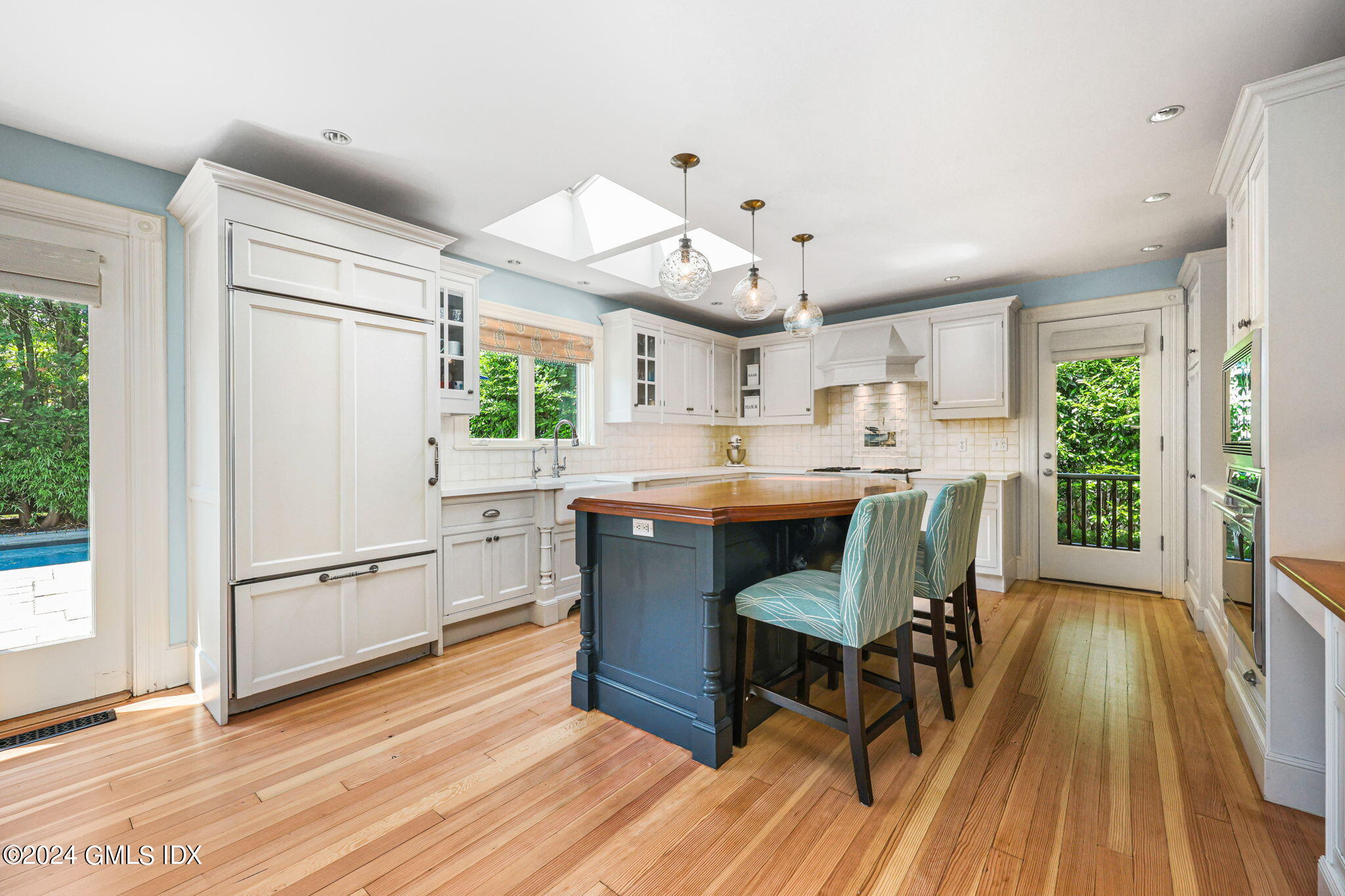 8 Hendrie Avenue Riverside, CT 06878 - Photo 12 of 33 a kitchen with a sink appliances a window and dining table