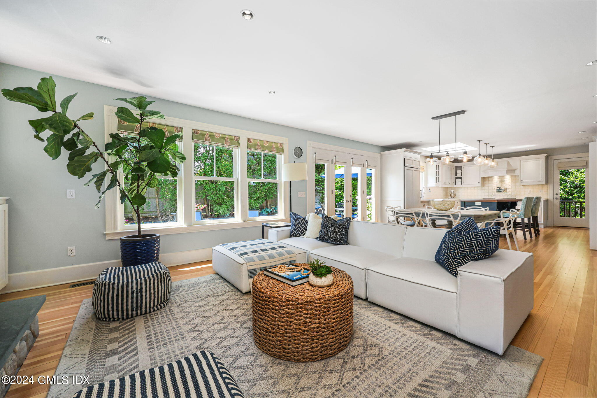 8 Hendrie Avenue Riverside, CT 06878 - Photo 17 of 33 a living room with furniture potted plant and a large window
