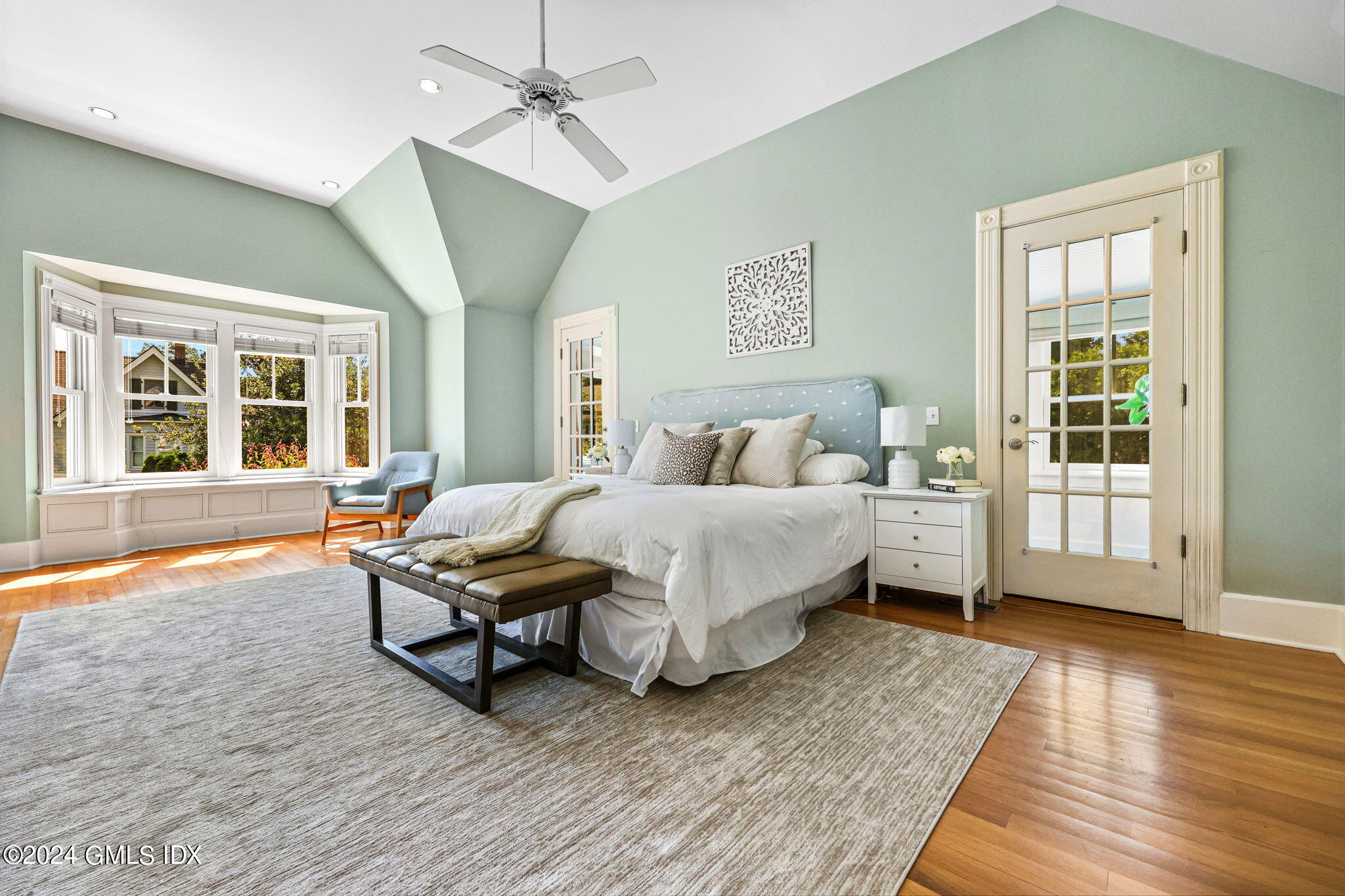 8 Hendrie Avenue Riverside, CT 06878 - Photo 19 of 33 a bedroom with a bed and wooden floor