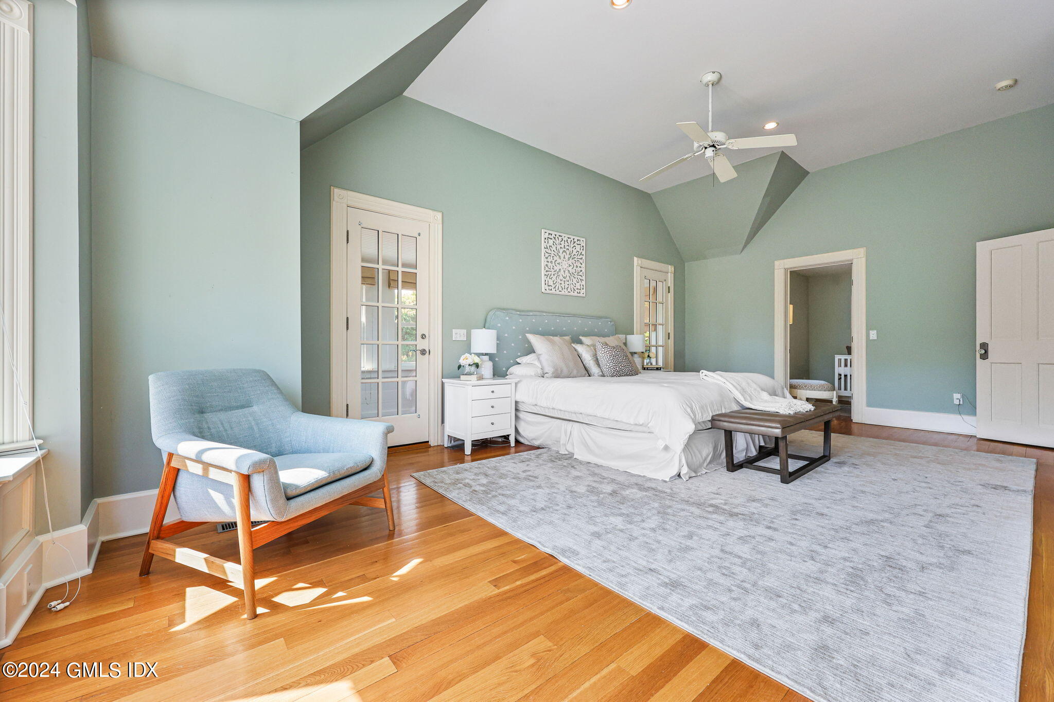 8 Hendrie Avenue Riverside, CT 06878 - Photo 20 of 33 a living room with furniture and a chandelier