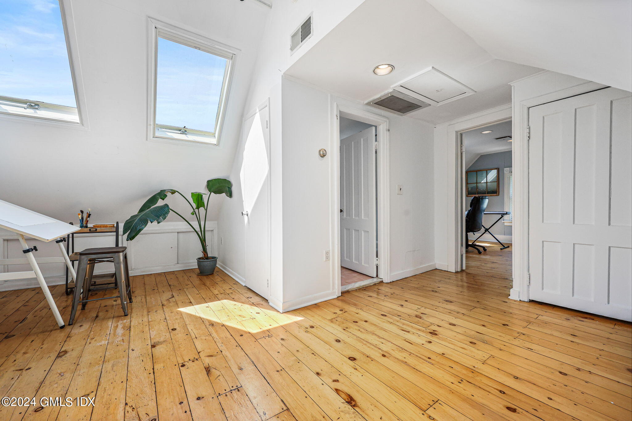 8 Hendrie Avenue Riverside, CT 06878 - Photo 27 of 33 a view of a livingroom with wooden floor and furniture
