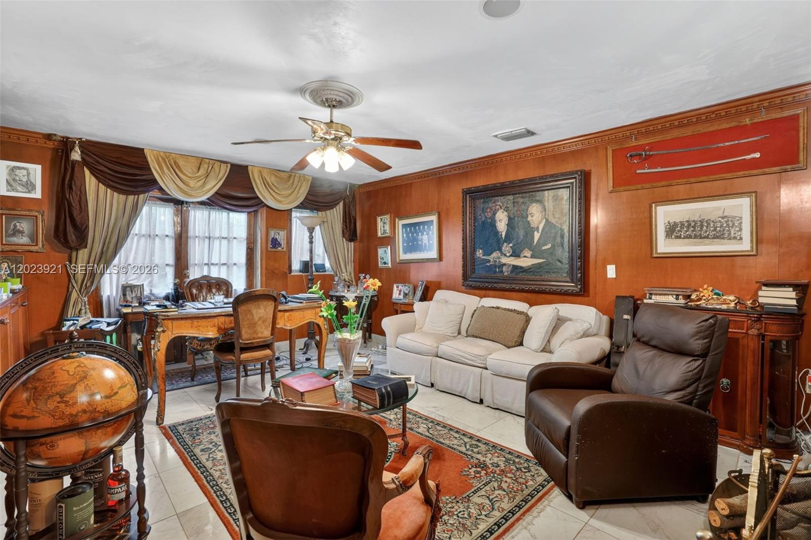 8461 Southwest 68th St Road Miami, FL 33143 - Photo 45 of 65 a living room with furniture a ceiling fan and a window