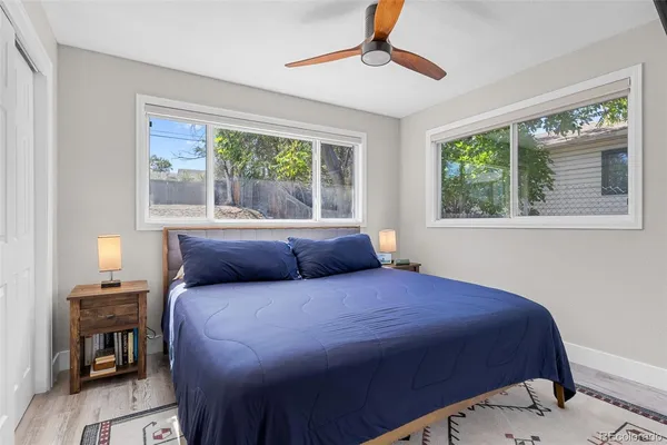 a bedroom with a large bed and a window