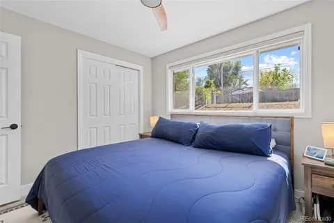 a bedroom with a bed and window