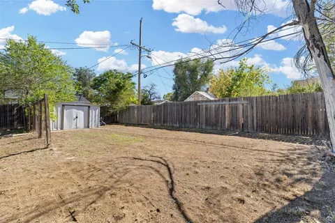 a view of a backyard of the house