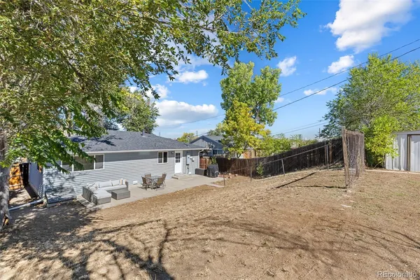a view of a backyard of the house