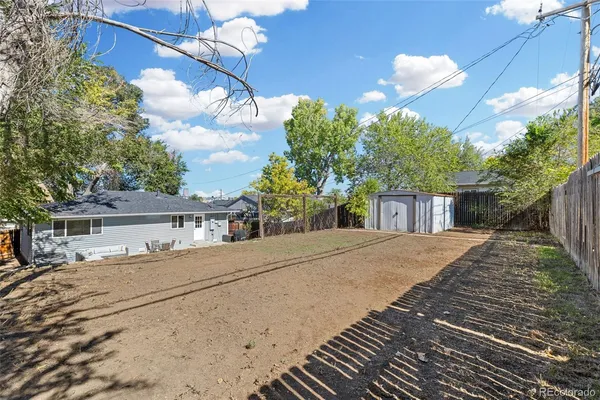 a front view of a house with a yard and a garage