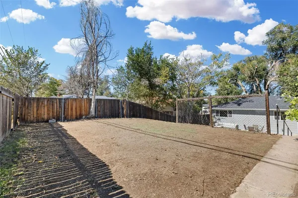 a backyard of a house with lots of green space