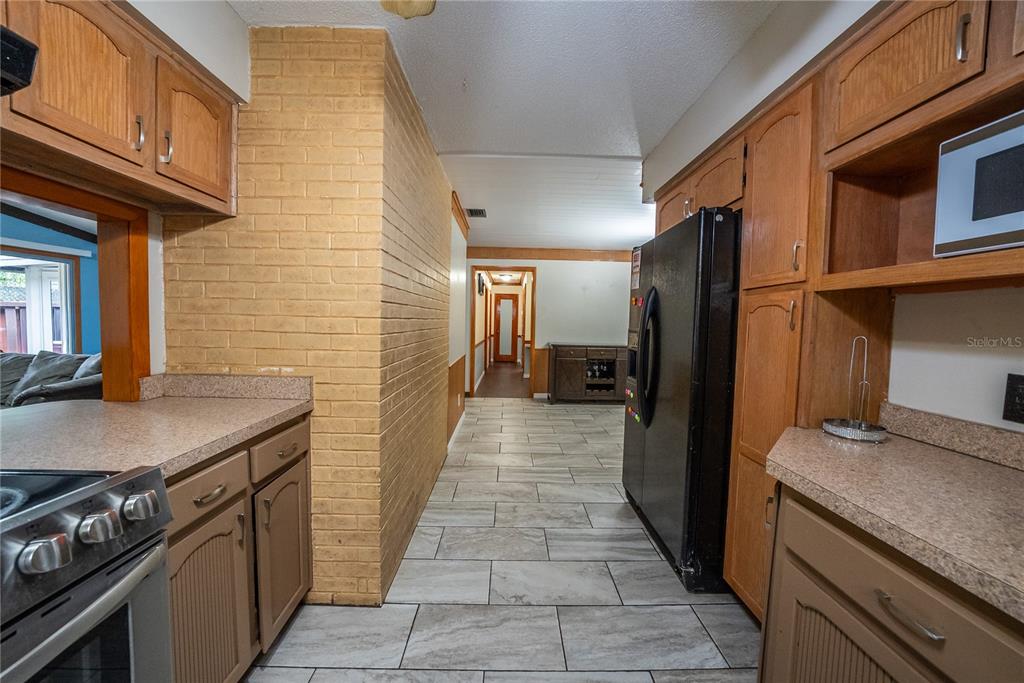 12 Spring Lake Way Ocala, FL 34472 - Photo 13 of 57 a kitchen with stainless steel appliances granite countertop a stove and a refrigerator