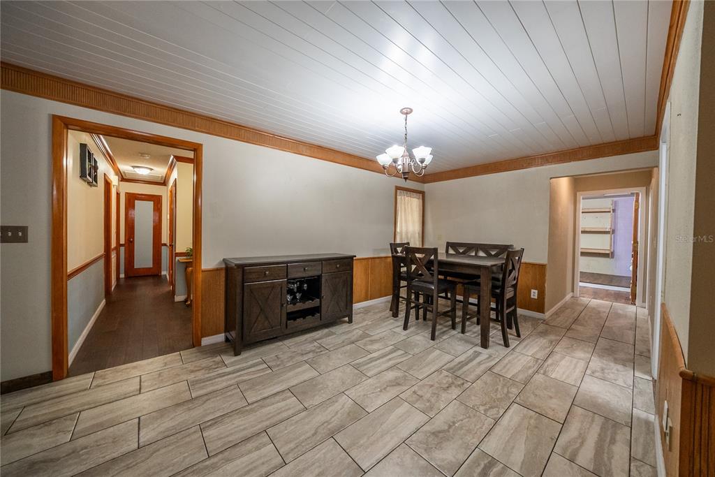 12 Spring Lake Way Ocala, FL 34472 - Photo 14 of 57 a view of a dining room with furniture and chandelier