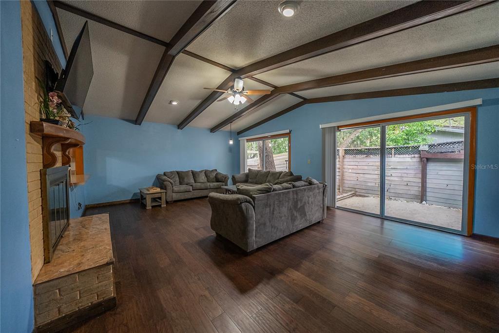 12 Spring Lake Way Ocala, FL 34472 - Photo 16 of 57 a living room with furniture and a flat screen tv