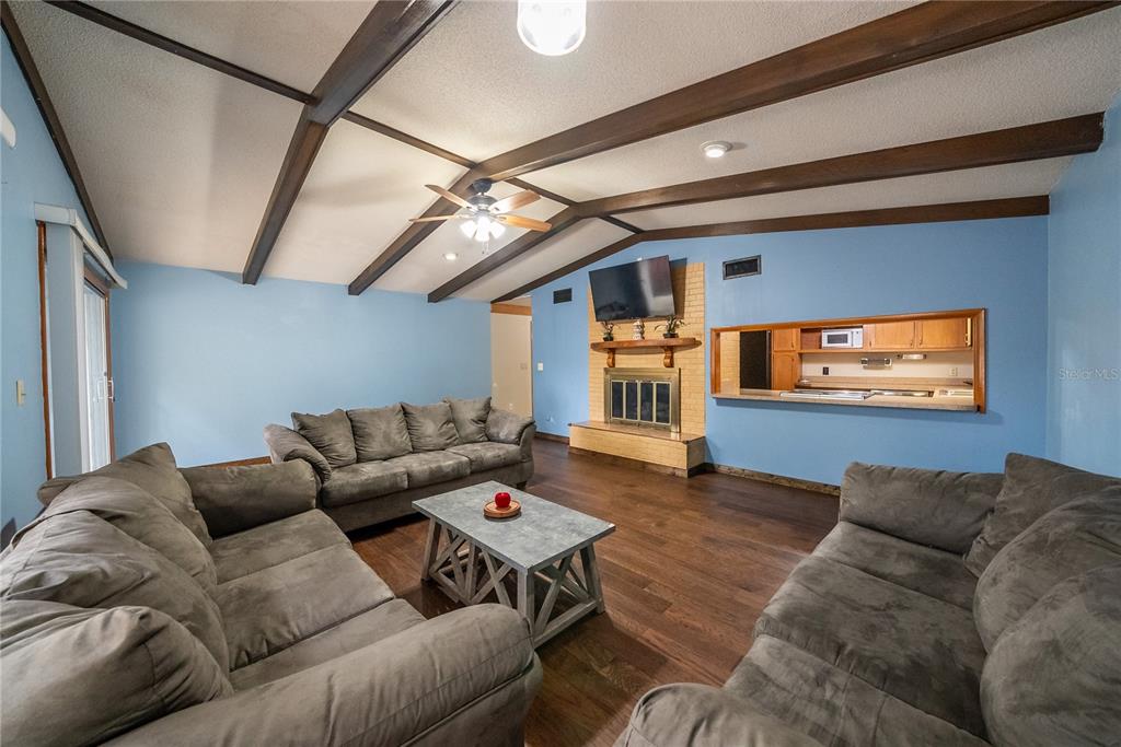 12 Spring Lake Way Ocala, FL 34472 - Photo 18 of 57 a living room with furniture and a flat screen tv