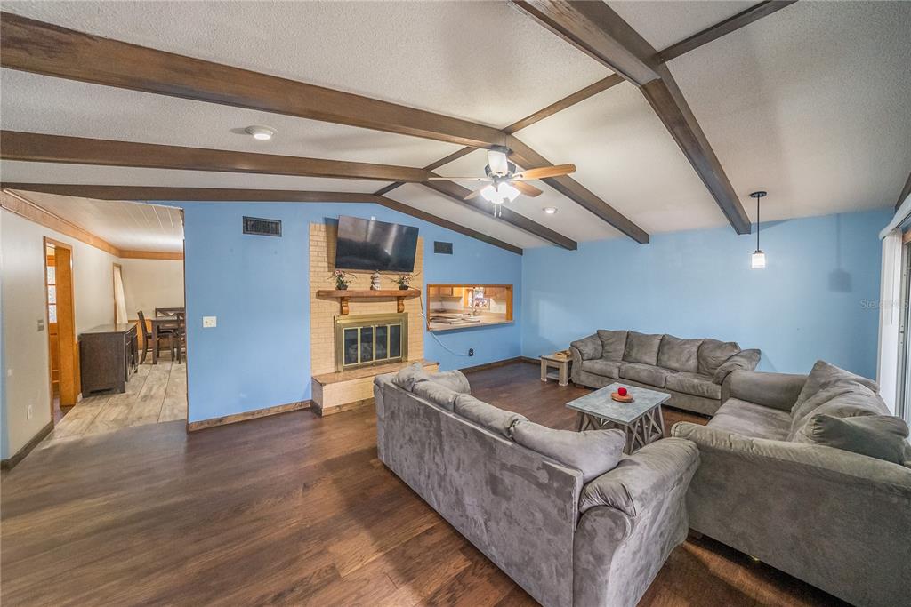 12 Spring Lake Way Ocala, FL 34472 - Photo 20 of 57 a living room with furniture and a wooden floor