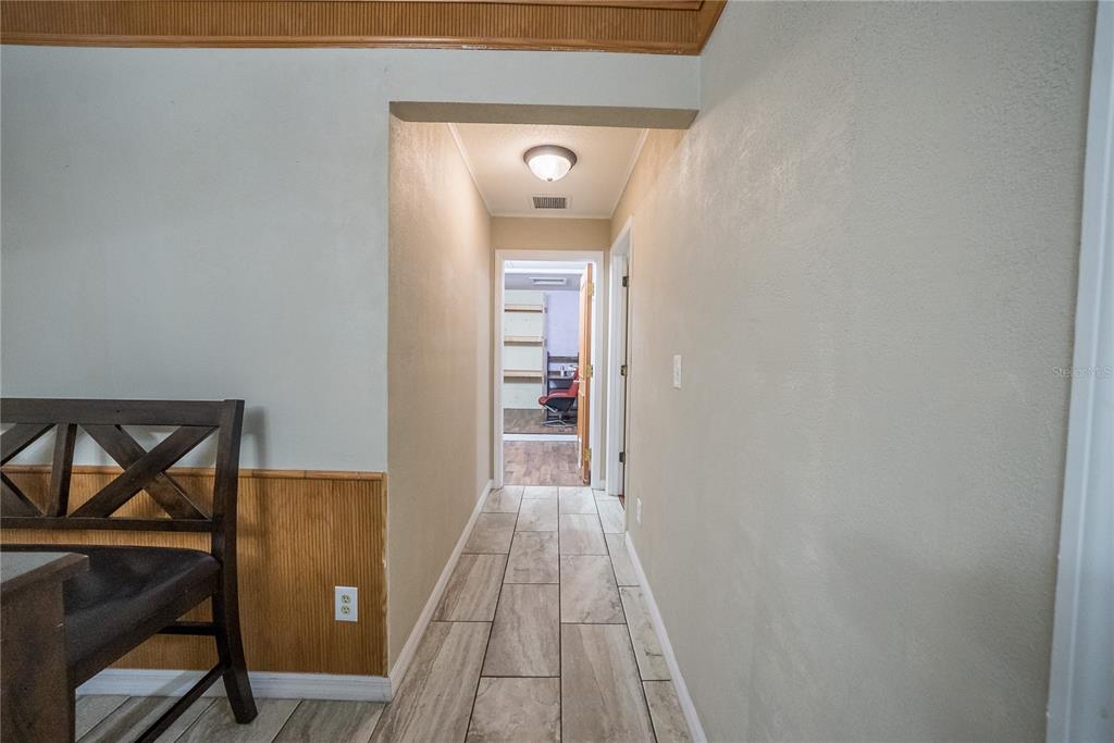 12 Spring Lake Way Ocala, FL 34472 - Photo 21 of 57 a view of a hallway view with wooden floor and staircase