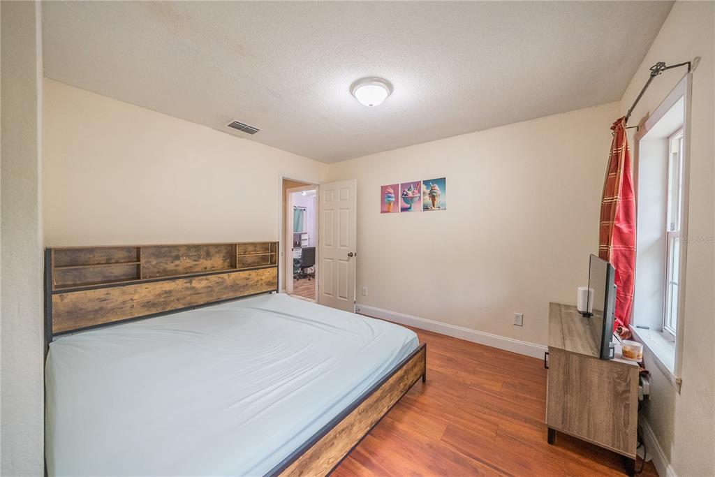 12 Spring Lake Way Ocala, FL 34472 - Photo 22 of 57 a view of a bedroom with wooden floor and closet