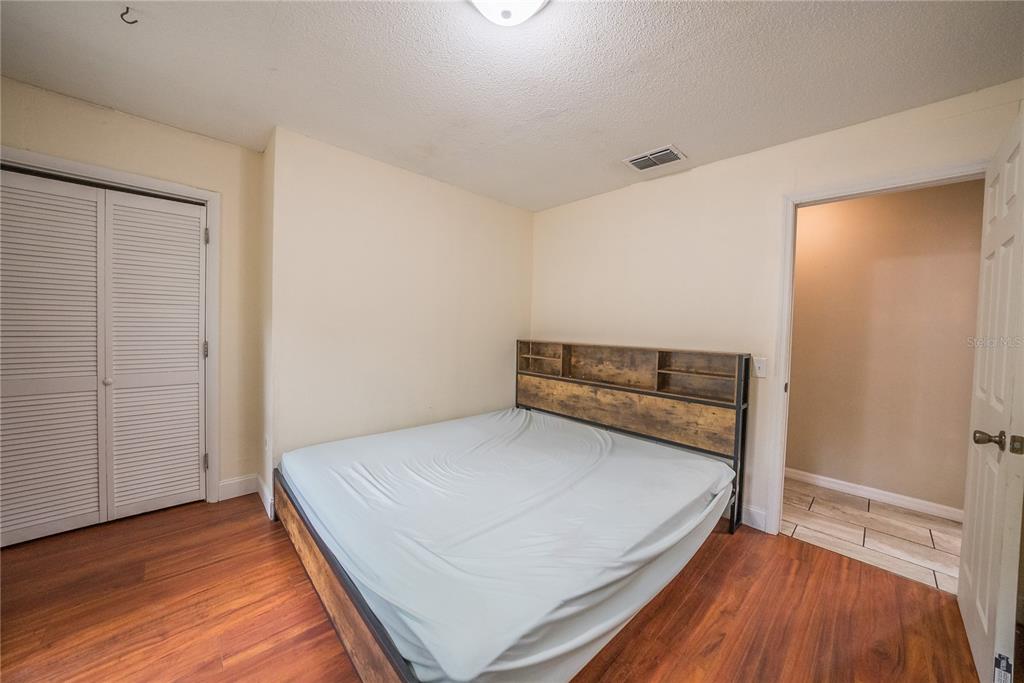 12 Spring Lake Way Ocala, FL 34472 - Photo 24 of 57 a view of bedroom and bedroom with wooden floor