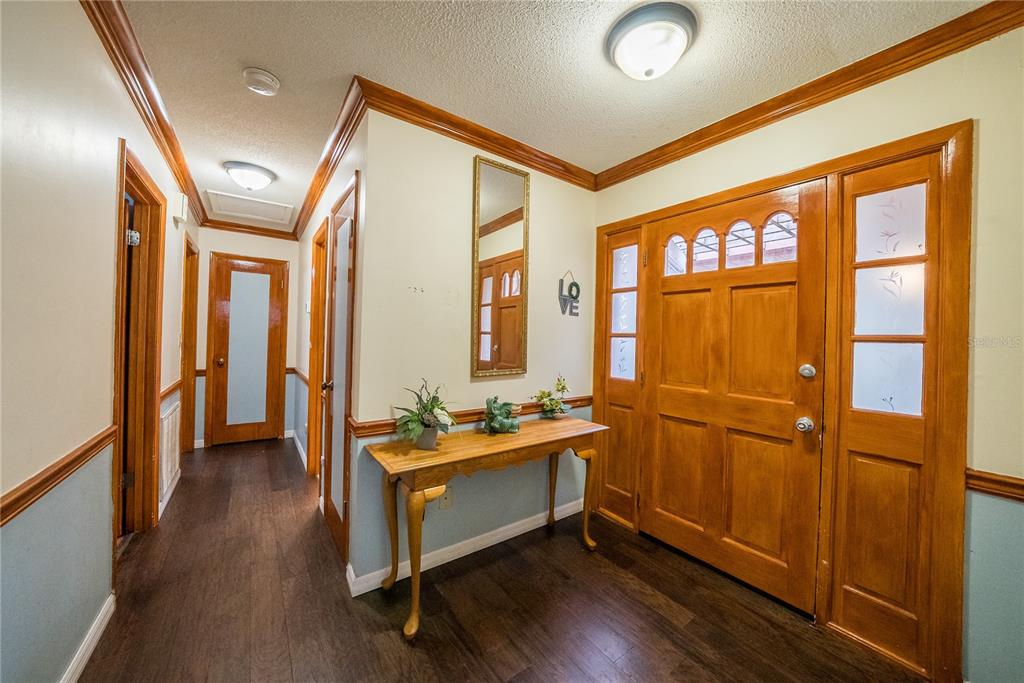 12 Spring Lake Way Ocala, FL 34472 - Photo 27 of 57 a room with wooden floor and furniture