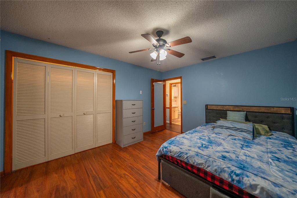 12 Spring Lake Way Ocala, FL 34472 - Photo 29 of 57 a bedroom with a bed and a window