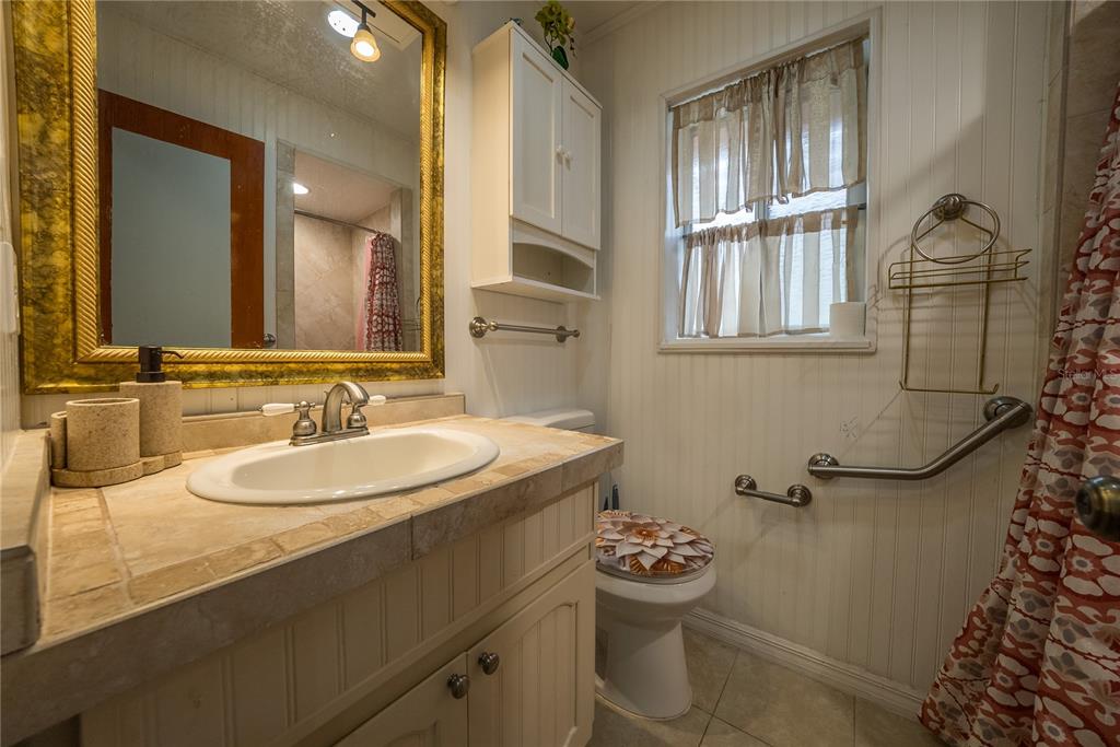 12 Spring Lake Way Ocala, FL 34472 - Photo 30 of 57 a bathroom with a sink toilet and shower