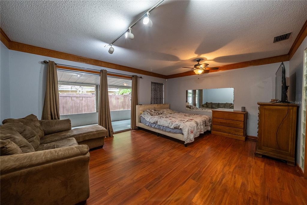 12 Spring Lake Way Ocala, FL 34472 - Photo 34 of 57 a bedroom with a large bed and a couch