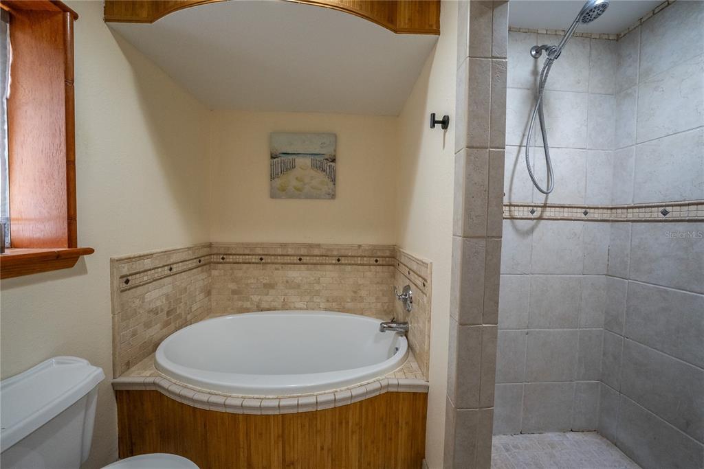 12 Spring Lake Way Ocala, FL 34472 - Photo 39 of 57 a bathroom with a toilet and a shower