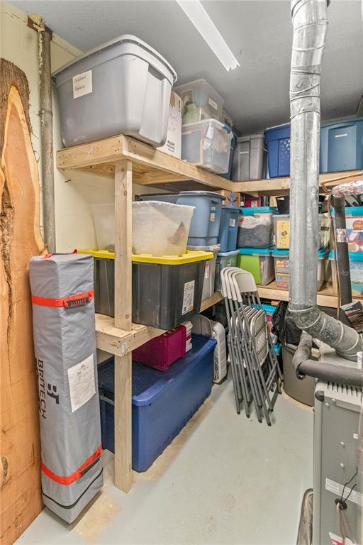 12 Spring Lake Way Ocala, FL 34472 - Photo 41 of 57 a garage filled with furniture and a chandelier