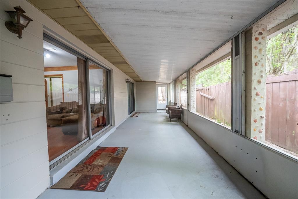 12 Spring Lake Way Ocala, FL 34472 - Photo 45 of 57 a view of an entryway with floor to ceiling windows
