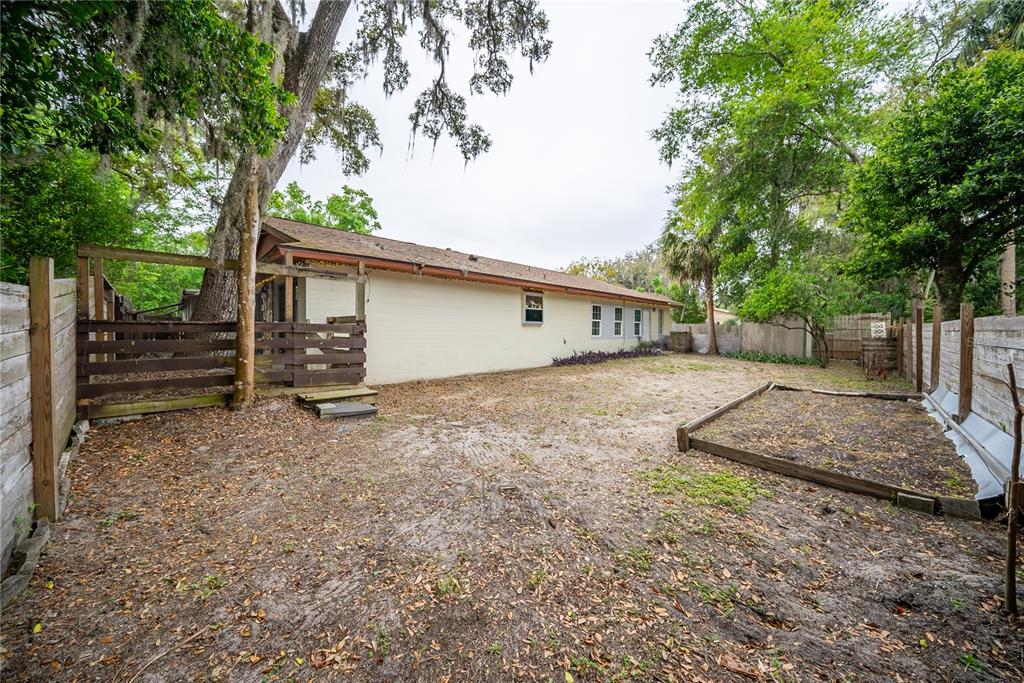 12 Spring Lake Way Ocala, FL 34472 - Photo 52 of 57 a view of a house with a yard and garage