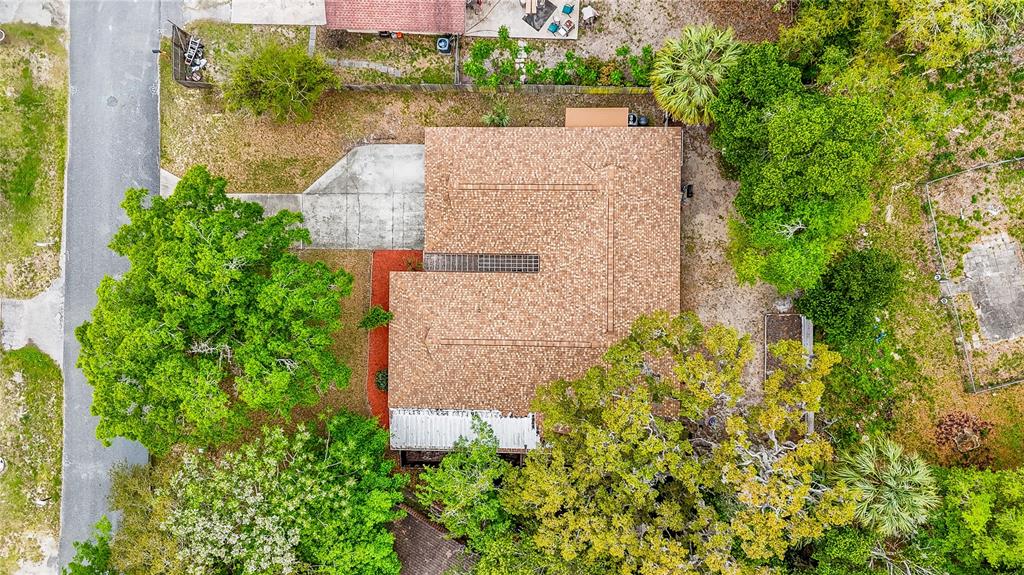 12 Spring Lake Way Ocala, FL 34472 - Photo 56 of 57 an aerial view of a house with a yard and lake view