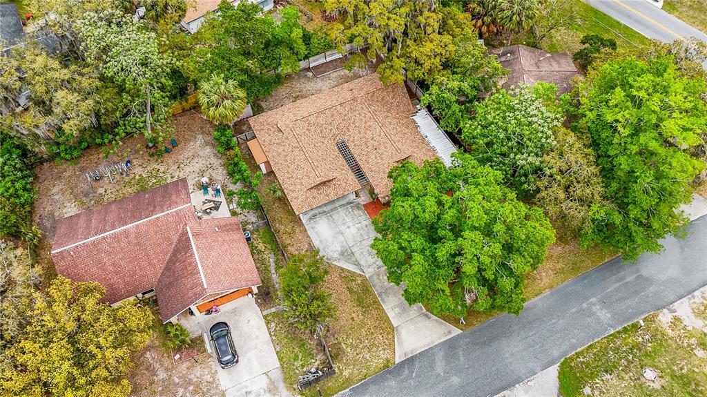 12 Spring Lake Way Ocala, FL 34472 - Photo 57 of 57 an aerial view of a house with garden space and sitting space