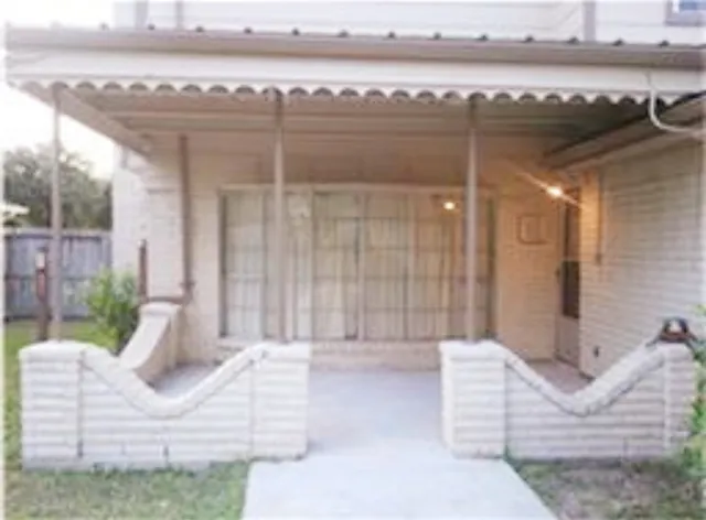 a view of a balcony with furniture