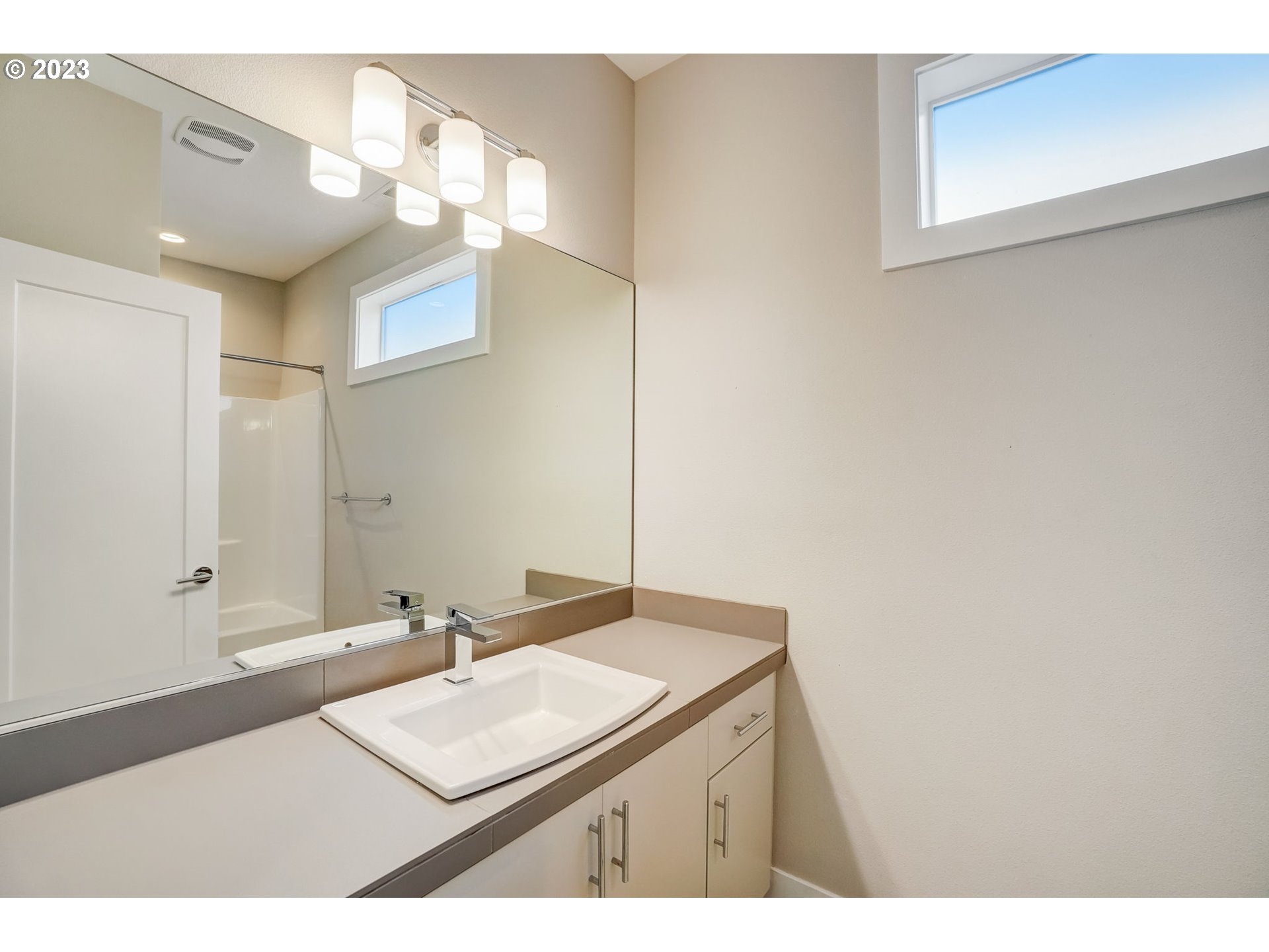 548 Southwest Chinook Terrace Portland, OR 97225 - Photo 21 of 44 a bathroom with a sink vanity and a mirror