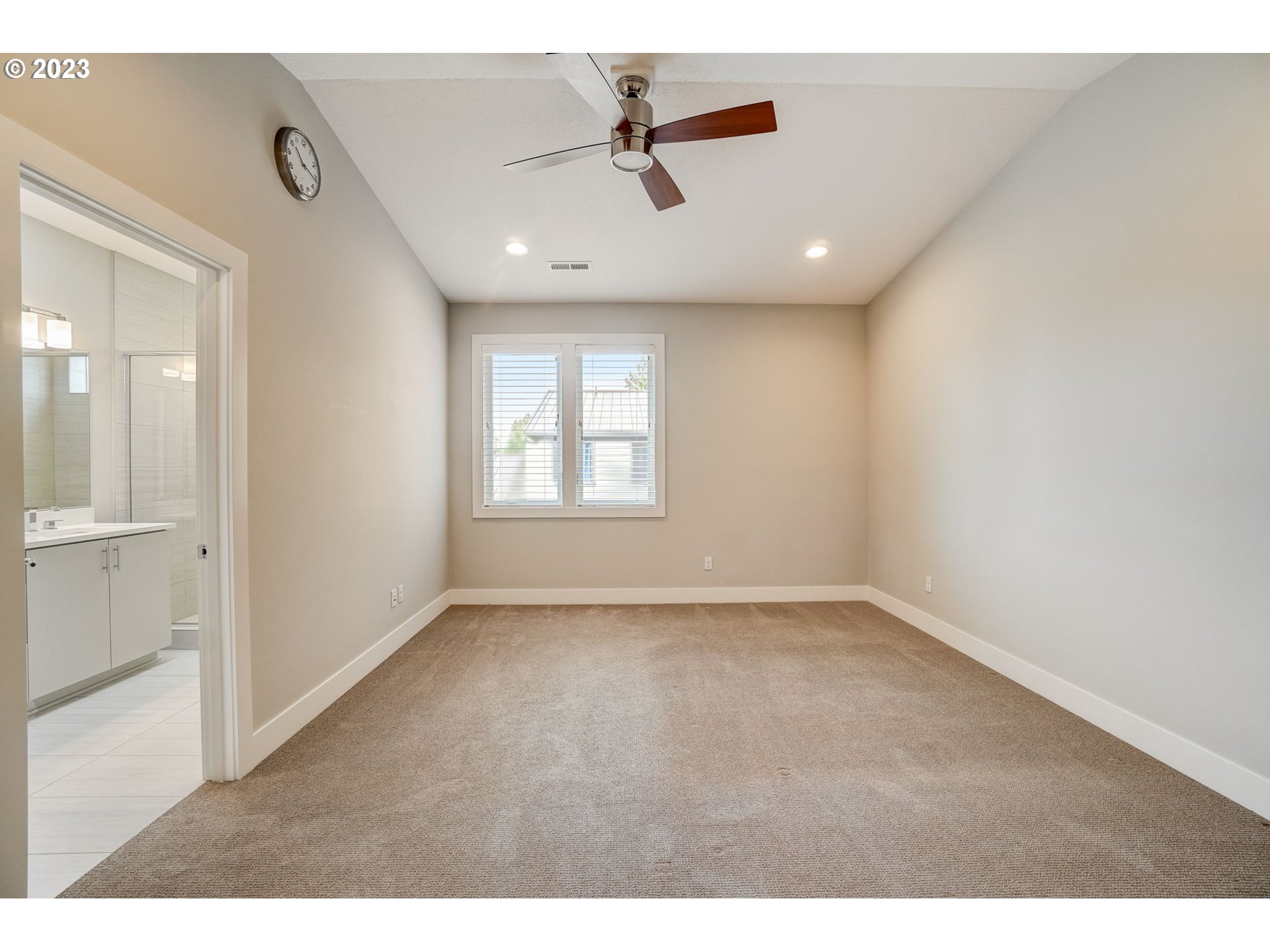 548 Southwest Chinook Terrace Portland, OR 97225 - Photo 28 of 44 an empty room with windows and ceiling fan