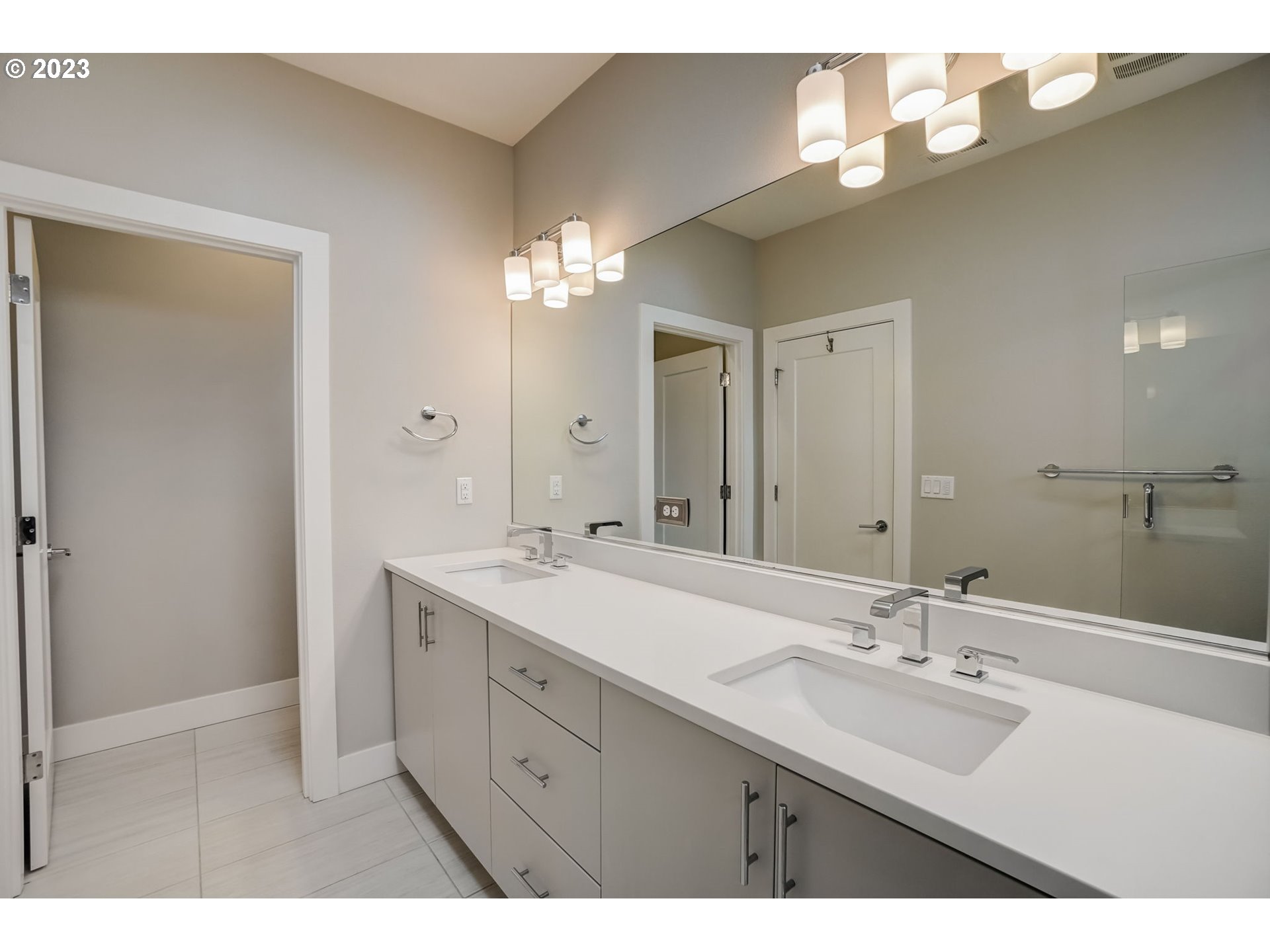 548 Southwest Chinook Terrace Portland, OR 97225 - Photo 35 of 44 a bathroom with a sink double vanity and a mirror