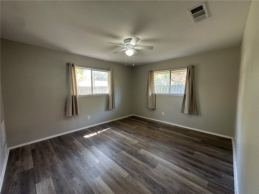 2994 Lovers Lane Ingleside, TX 78362 - Photo 14 of 39 an empty room with wooden floor and windows