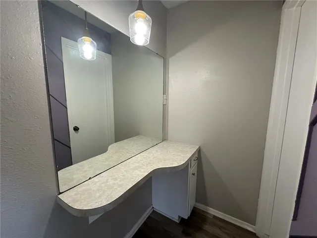 a room with a table and a mirror